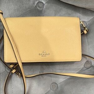Coach Tan Leather Crossbody Bag with Flap Closure